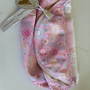 Stoney clover it’s a small world crossbody bag with gold zipper.